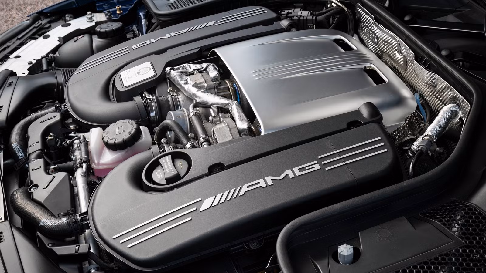 A cleaned and dressed engine bay in a Mercedes-AMG C63.